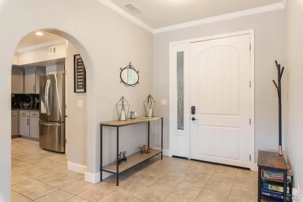 a living room with furniture a ceiling fan and a rug