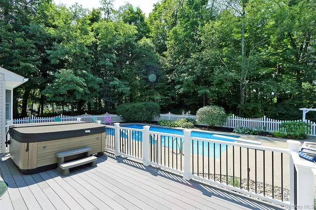 a backyard of a house with outdoor seating