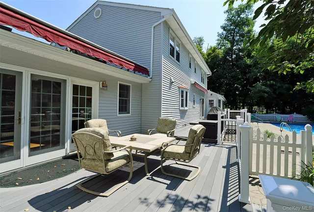 a view of a wooden deck and a yard