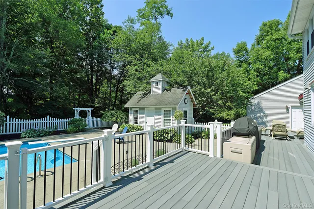 a living room with furniture pool table and a large window