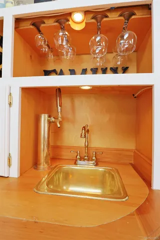 a living room with furniture a fireplace and a large window