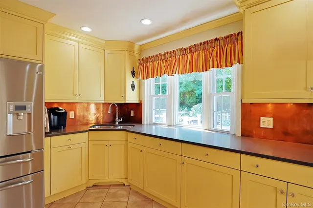 a view of a glass door with a yard