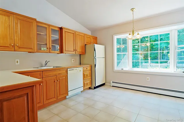 a bathroom with a sink a mirror and a shower