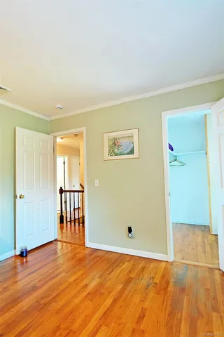 a spacious bathroom with a double vanity sink toilet mirror and bathtub