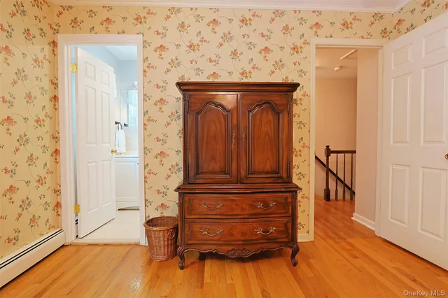 a bathroom with a toilet sink and shower