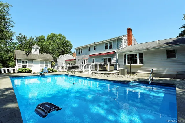 a front view of house with yard and outdoor seating