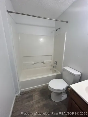 a view of a kitchen with a table and chairs