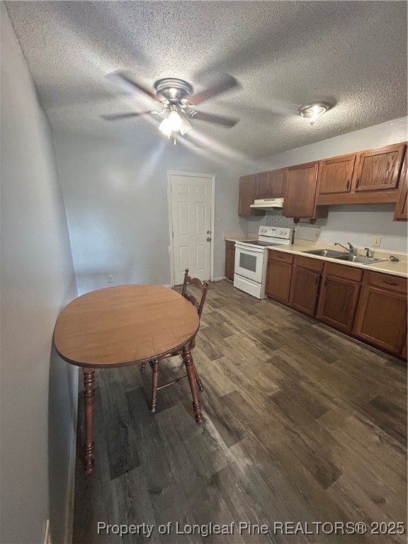 1378 Singletree Lane Raeford, NC 28376 - Photo 16 of 18 a view of a kitchen with a table and chairs