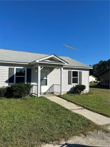 a view of a house with a back yard