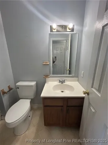 a white toilet sitting next to a shower curtain