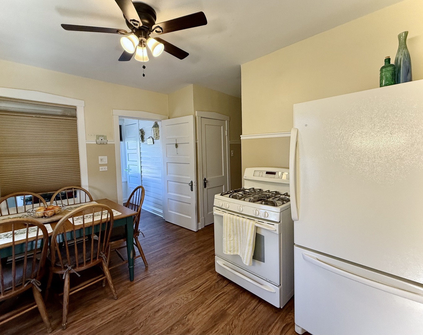 98 Northgate Road Riverside, IL 60546 - Photo 3 of 34 a kitchen with stainless steel appliances a stove a refrigerator a dining table and chairs