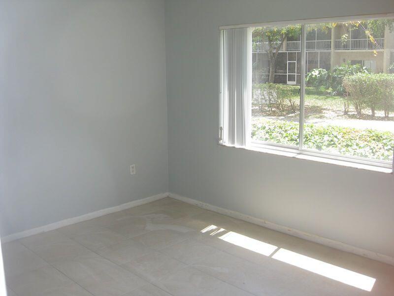 721 North Pine Island Road, Unit 116 Plantation, FL 33324 - Photo 12 of 23 an empty room with a window