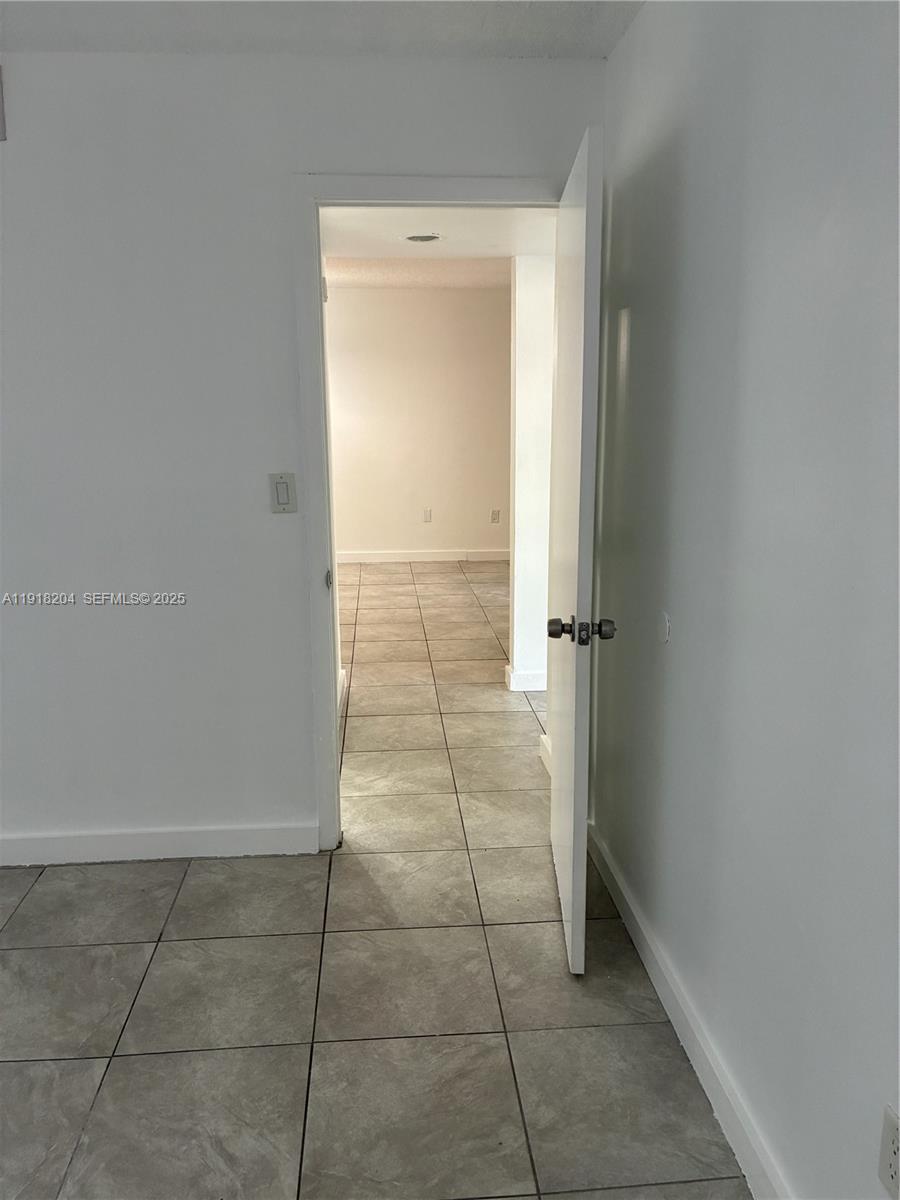10801 Southwest 109th Court, Unit D203 Miami, FL 33176 - Photo 17 of 28 a view of a hallway