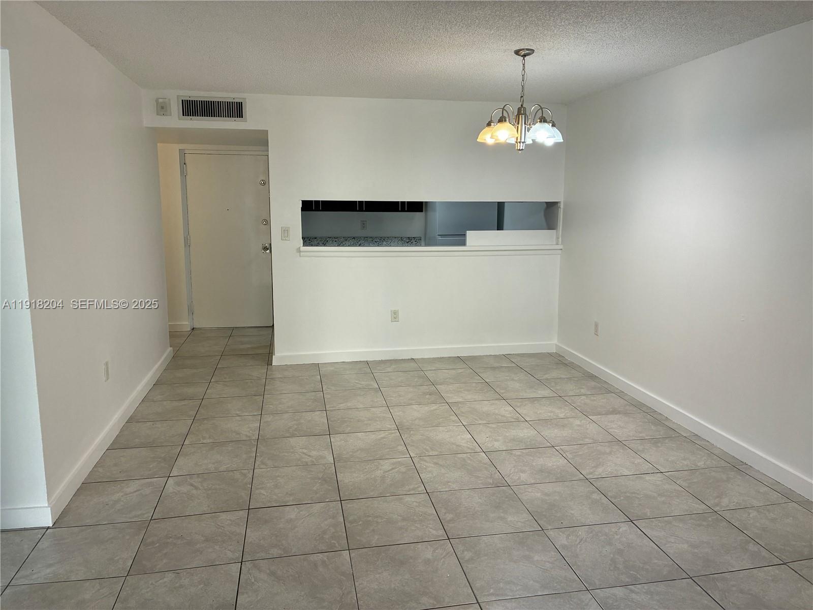 10801 Southwest 109th Court, Unit D203 Miami, FL 33176 - Photo 10 of 28 a view of a room with an empty space