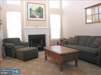 88 Threadleaf Terrace Burlington, NJ 08016 - Photo 5 of 10 a living room with furniture and a fireplace