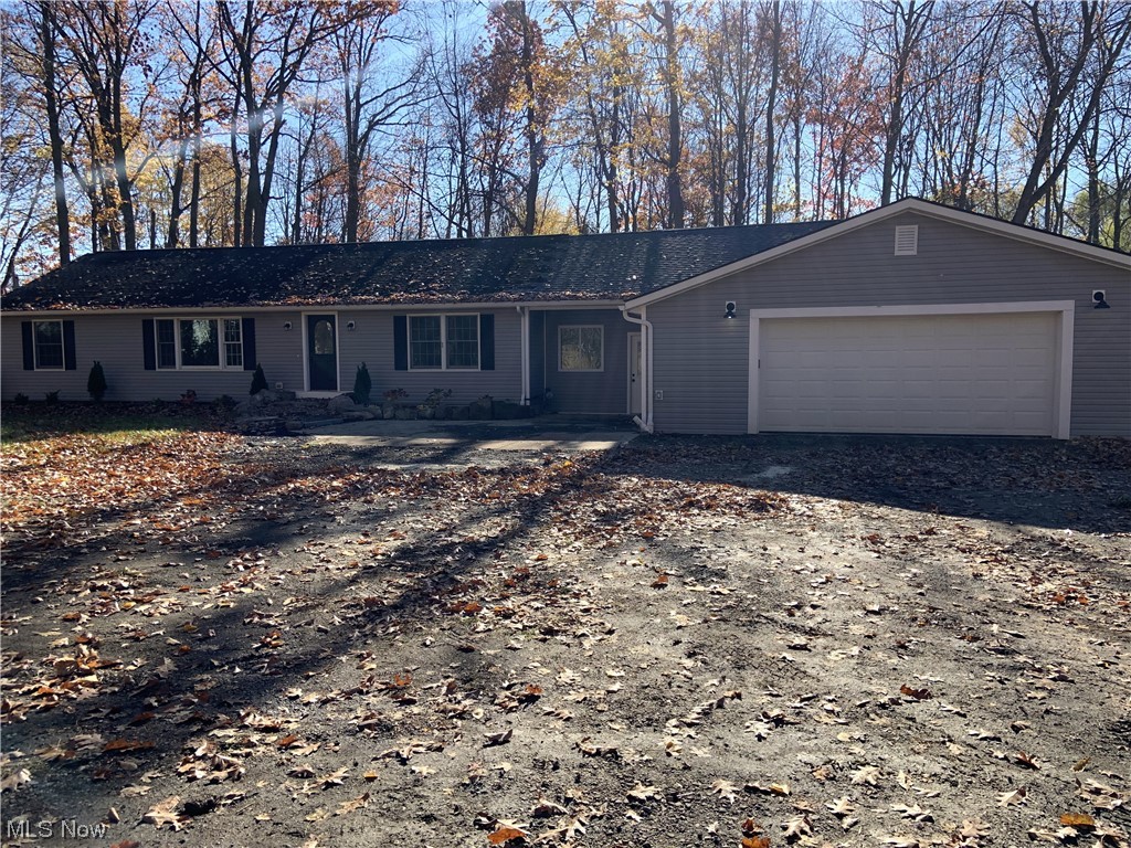 Single story home featuring a garage