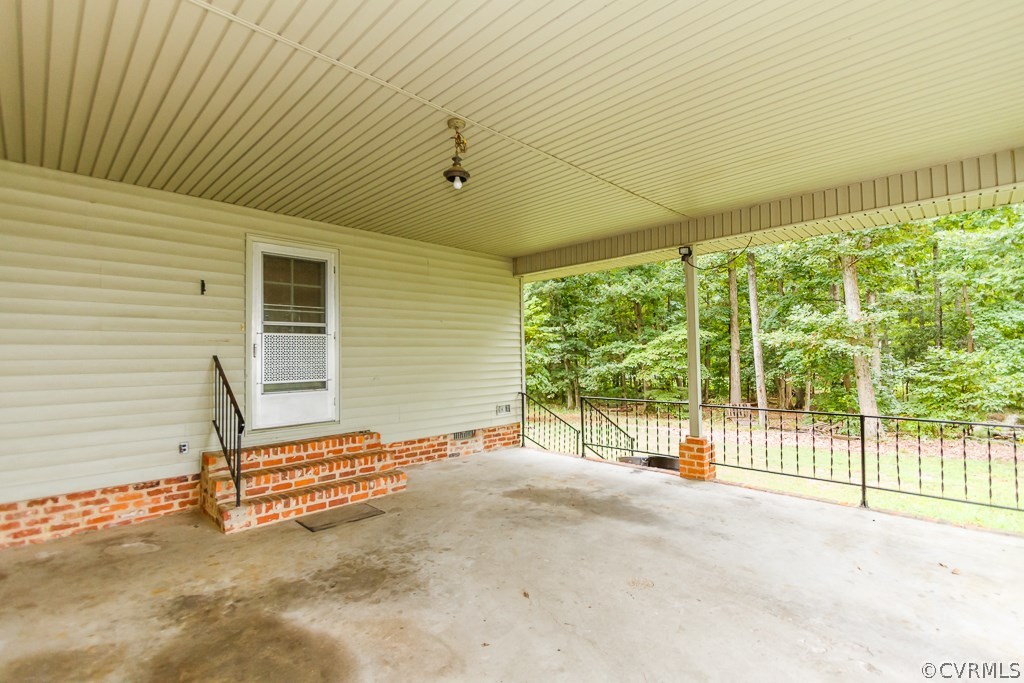 7433 River Road Hanover, VA 23069 - Photo 3 of 24 a view of backyard with wooden fence