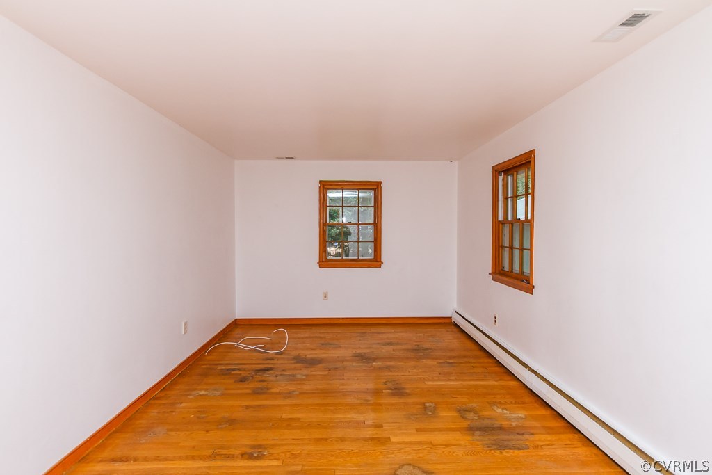 7433 River Road Hanover, VA 23069 - Photo 4 of 24 an empty room with windows
