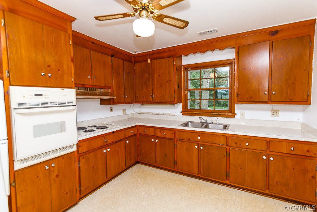 7433 River Road Hanover, VA 23069 - Photo 8 of 24 a kitchen with a sink cabinets and window