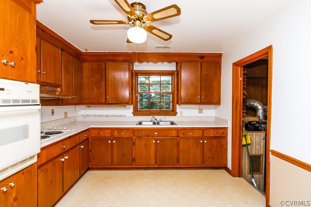 7433 River Road Hanover, VA 23069 - Photo 9 of 24 a large kitchen with a large window and stainless steel appliances