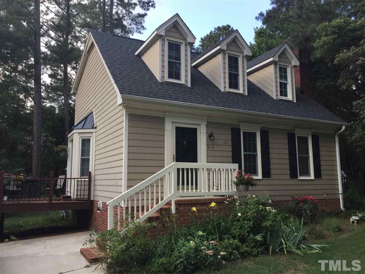 3113 East Folkestone Place Raleigh, NC 27604 - Photo 1 of 23 a front view of a house with a yard