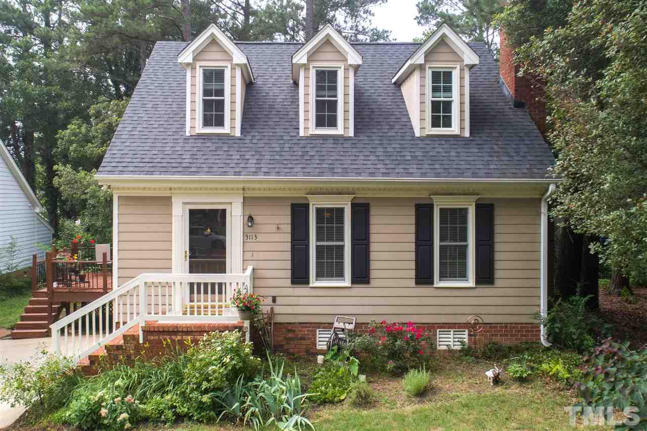 3113 East Folkestone Place Raleigh, NC 27604 - Photo 2 of 23 a front view of a house with a yard