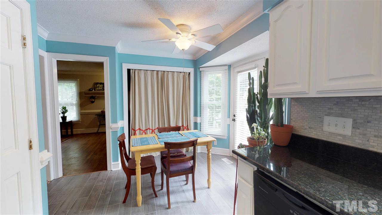 3113 East Folkestone Place Raleigh, NC 27604 - Photo 12 of 23 a dining room with furniture and window