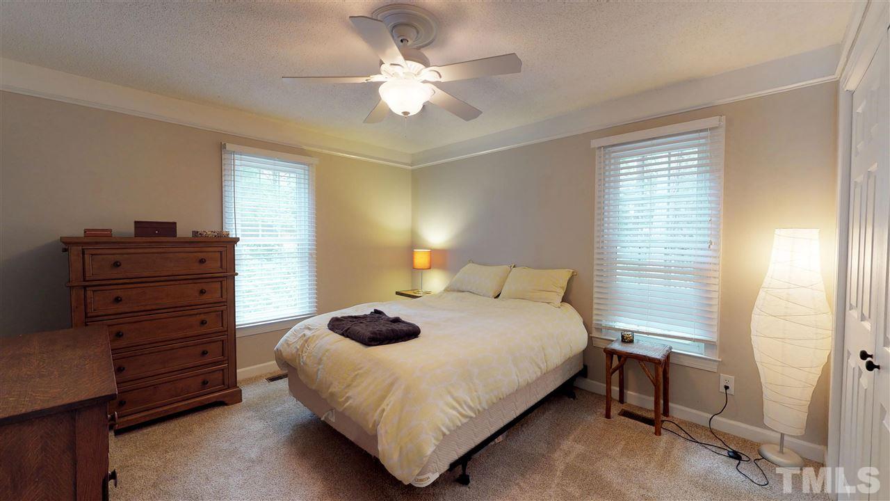 3113 East Folkestone Place Raleigh, NC 27604 - Photo 13 of 23 a bedroom with a bed and window
