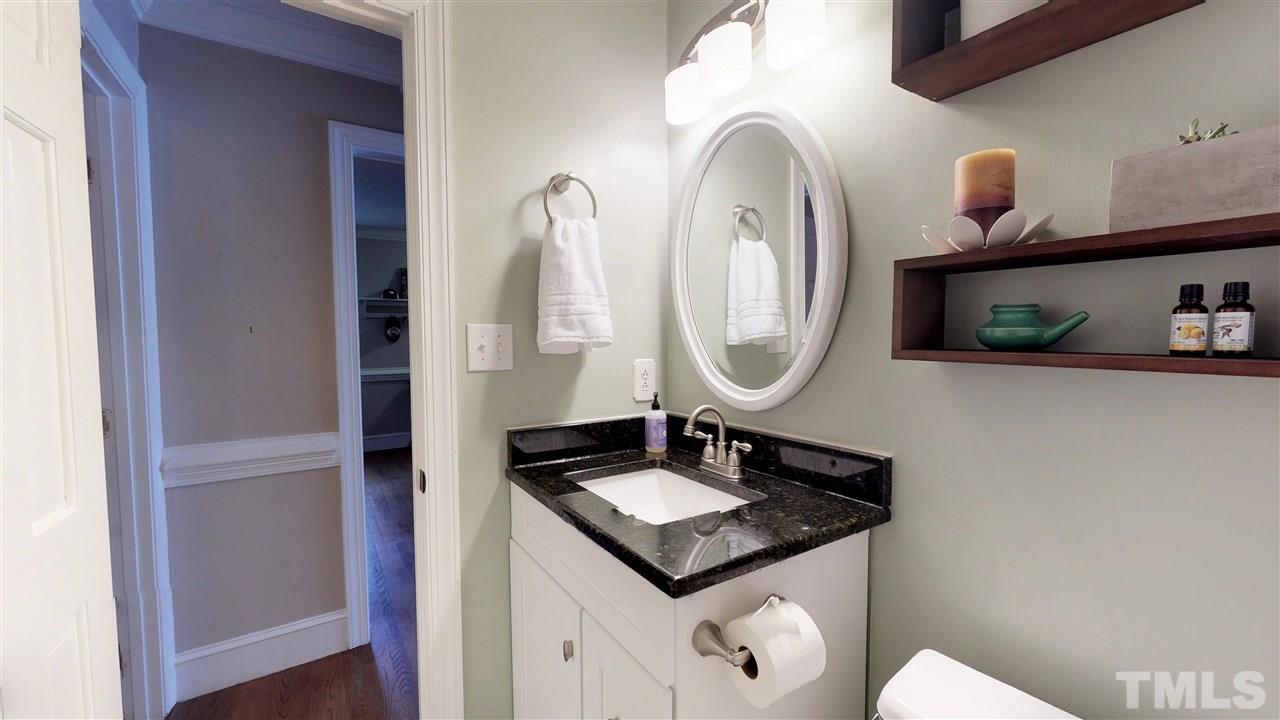 3113 East Folkestone Place Raleigh, NC 27604 - Photo 16 of 23 a bathroom with a sink and a mirror