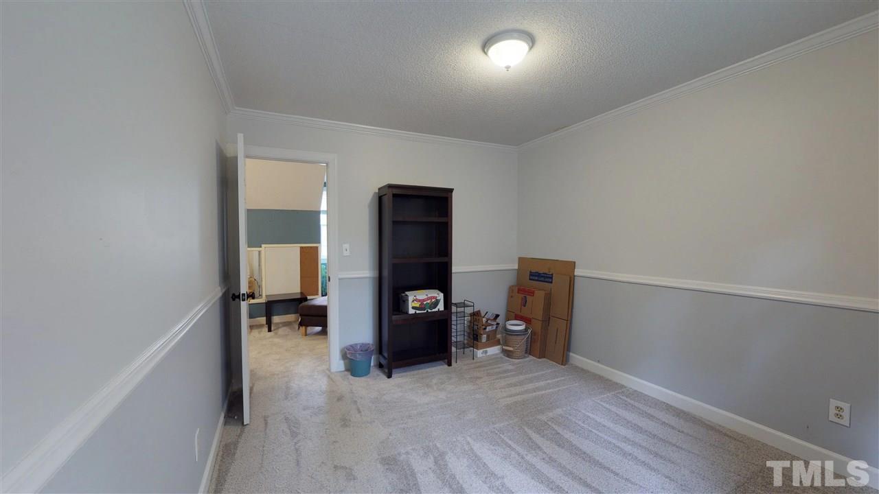 3113 East Folkestone Place Raleigh, NC 27604 - Photo 19 of 23 an entryway and livingroom with furniture