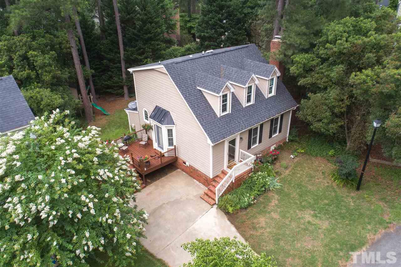 3113 East Folkestone Place Raleigh, NC 27604 - Photo 3 of 23 a view of a house with a yard
