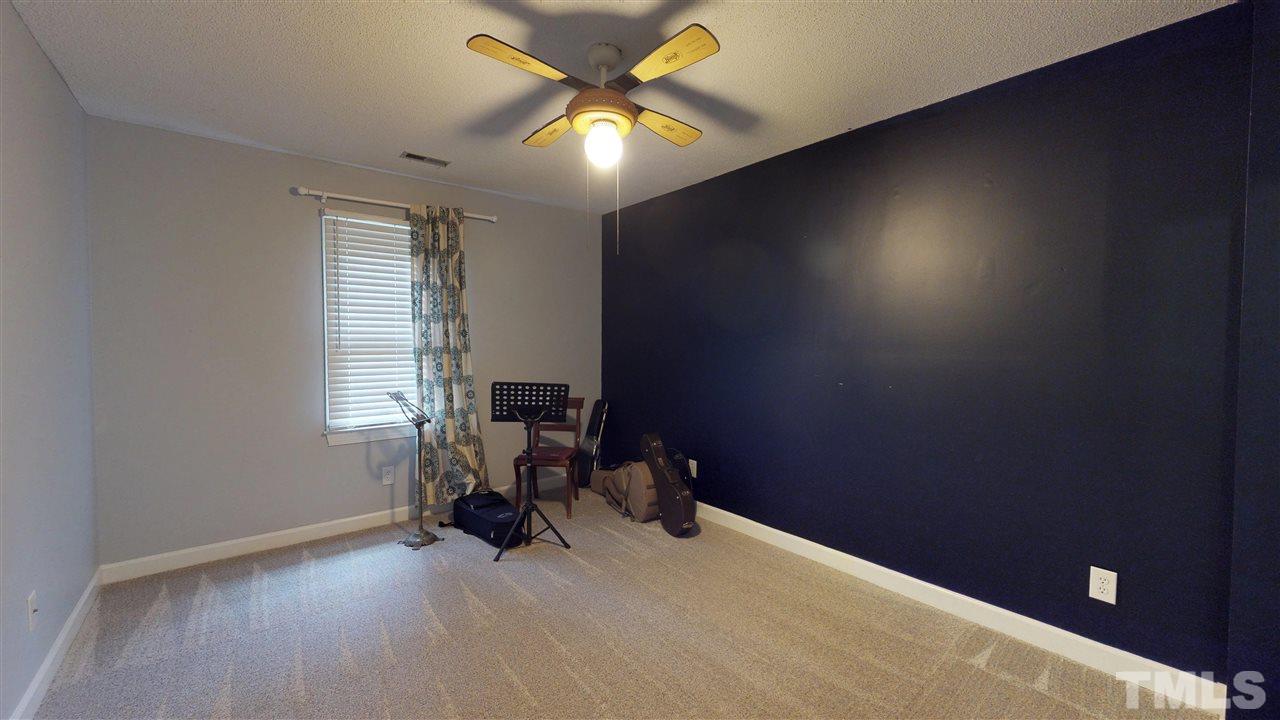 3113 East Folkestone Place Raleigh, NC 27604 - Photo 21 of 23 a view of workspace with furniture and a window