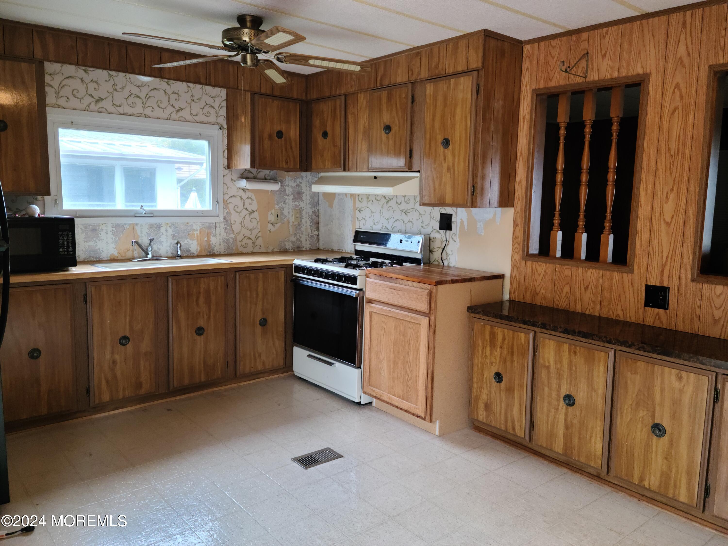 3 Judith Way Jackson, NJ 08527 - Photo 2 of 2 a kitchen with cabinets a sink and appliances
