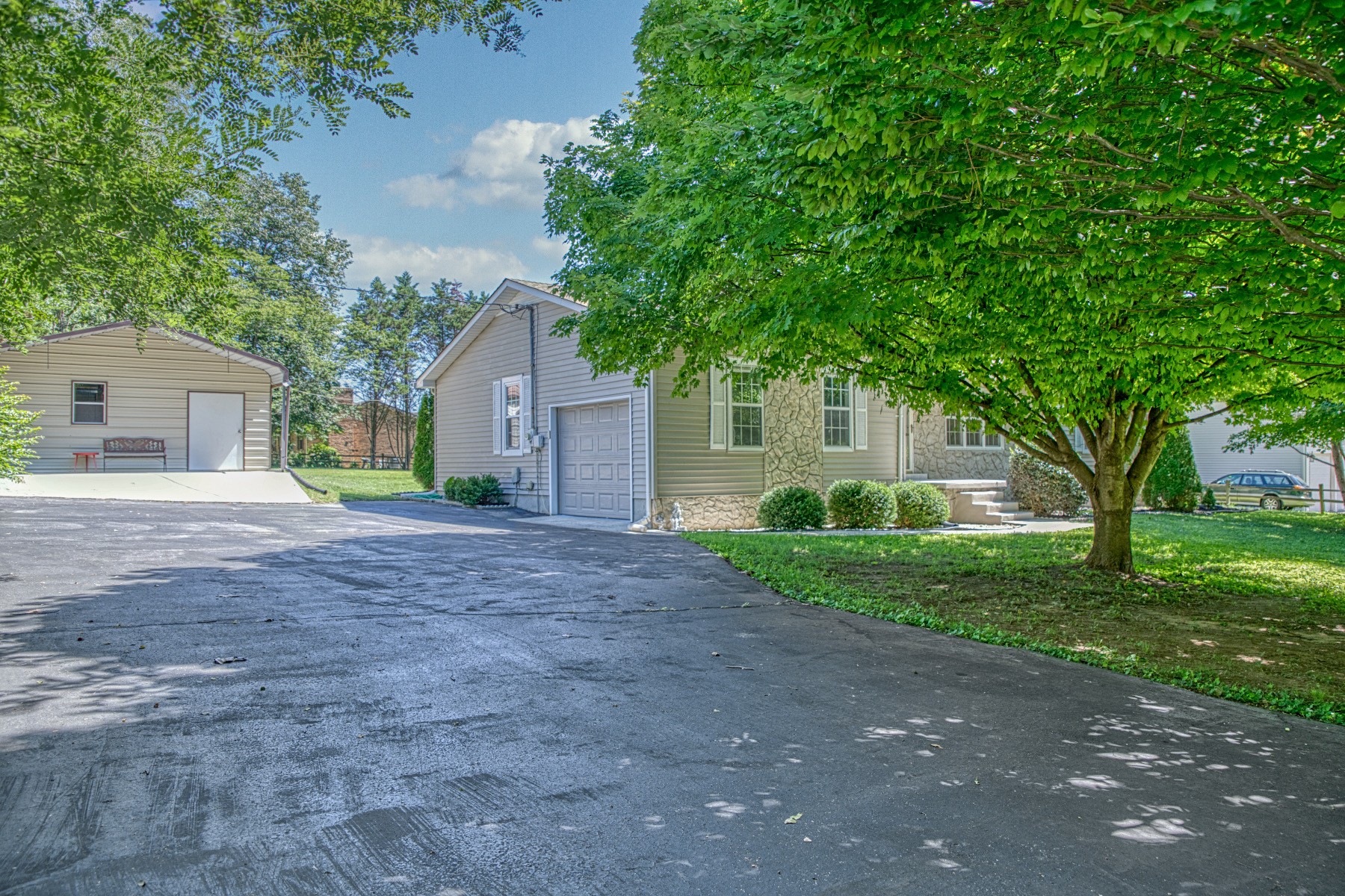 2085 Herbert Garrett Road Cookeville, TN 38506 - Photo 4 of 39 a front view of a house with garden