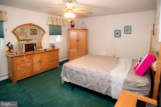 a bed room with a bed and a television