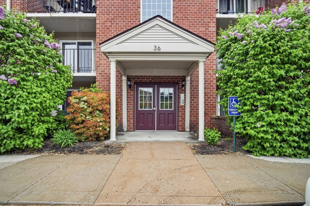 36 Maple Crest Circle, Unit F Holyoke, MA 01040 - Photo 1 of 16 a view of entrance of the house with potted plants
