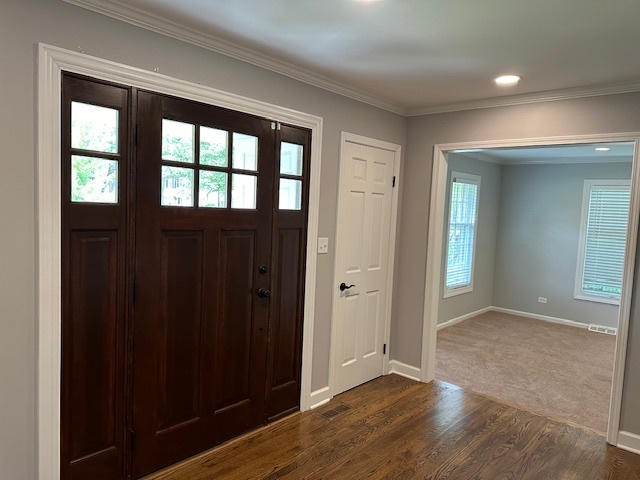 1253 West Illinois Avenue Palatine, IL 60067 - Photo 2 of 18 an empty room with wooden floor and windows