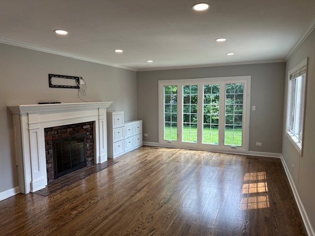 1253 West Illinois Avenue Palatine, IL 60067 - Photo 3 of 18 a view of an empty room with wooden floor and a window
