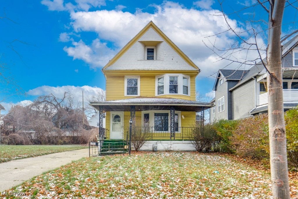 13702 Rugby Road Cleveland, OH 44110 - Photo 1 of 22 Victorian home with covered porch and a front lawn