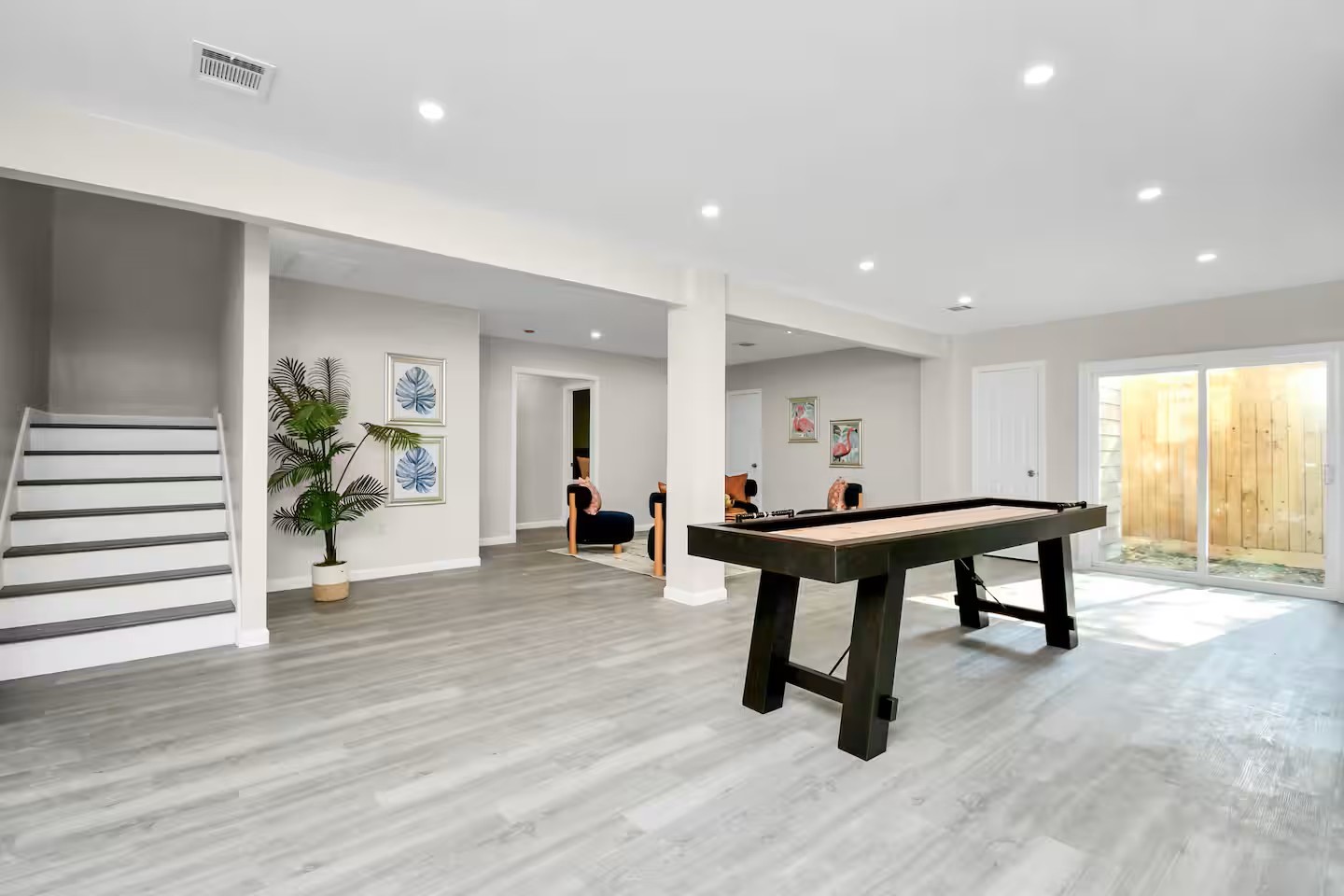 3318 Wichita Street Houston, TX 77004 - Photo 15 of 36 a room with furniture and a wooden floor