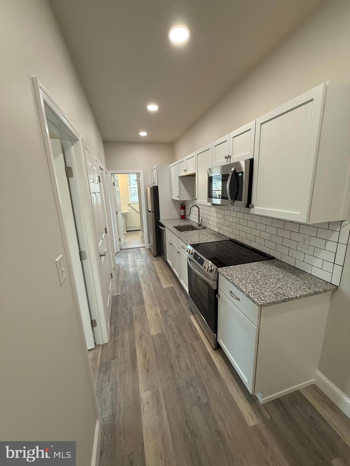 1383 Friedensburg Road, Unit A Reading, PA 19606 - Photo 1 of 13 a kitchen with stainless steel appliances granite countertop a stove and a sink