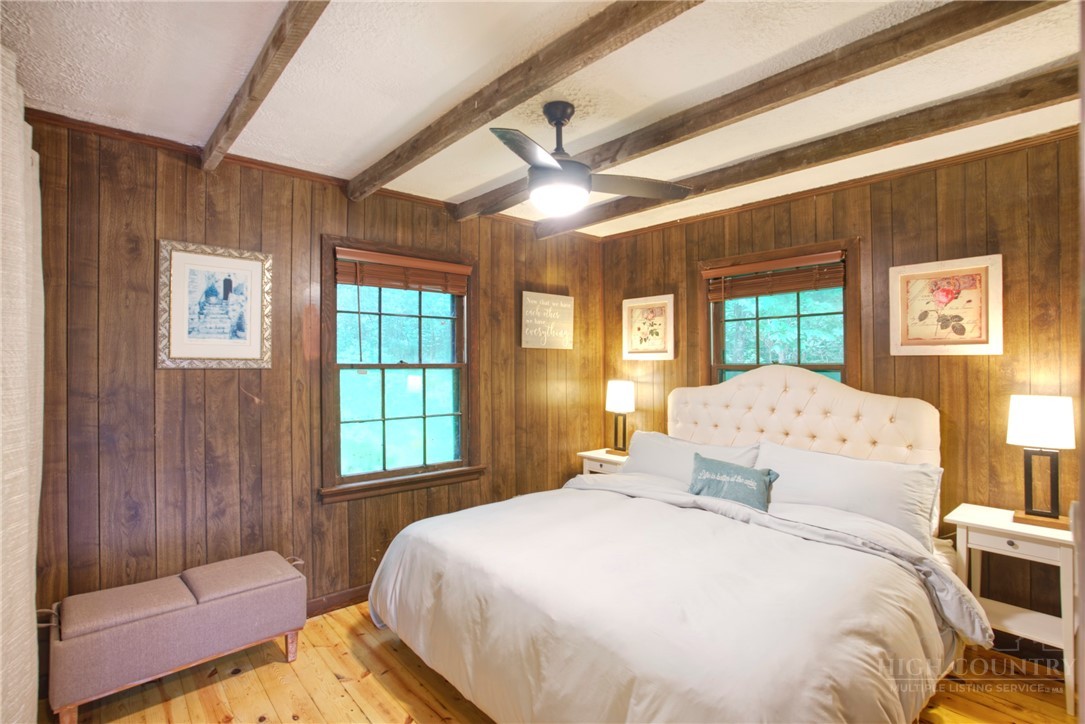 9440 Blackberry Road Lenoir, NC 28645 - Photo 12 of 30 a spacious bedroom with a bed and a large window