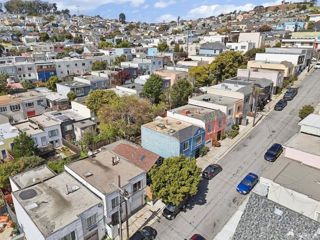 an aerial view of a city with lots of residential buildings