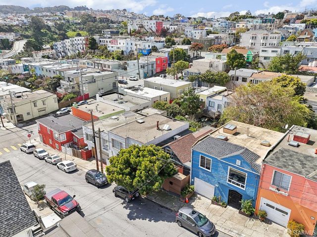 an aerial view of a city with lots of residential buildings