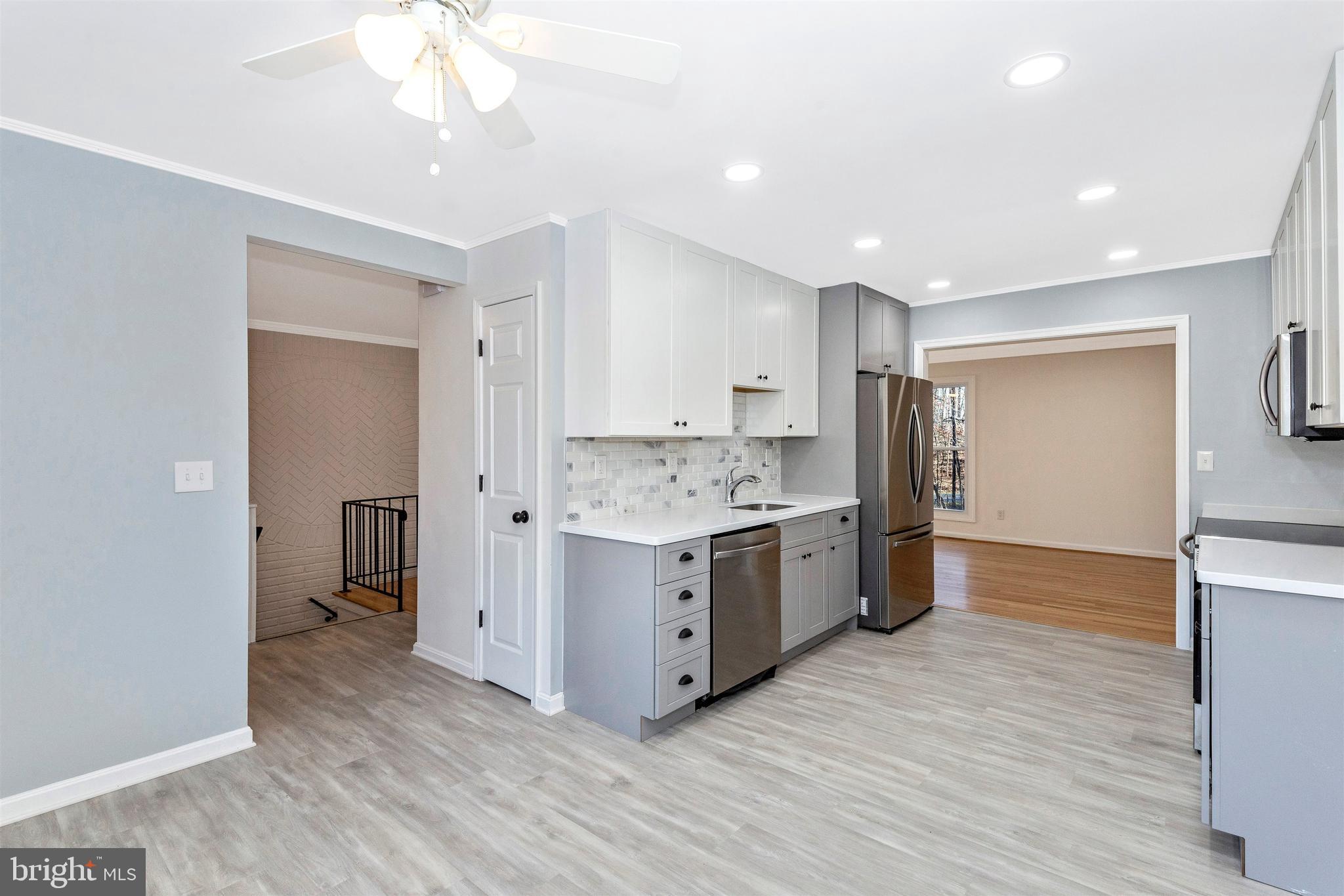 2233 Kings House Road Silver Spring, MD 20905 - Photo 11 of 36 Kitchen view into the Foyer and Dining Room