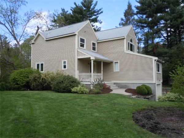 8 David Drive, Unit 8 Natick, MA 01760 - Photo 2 of 9 a view of a house with a yard and potted plants