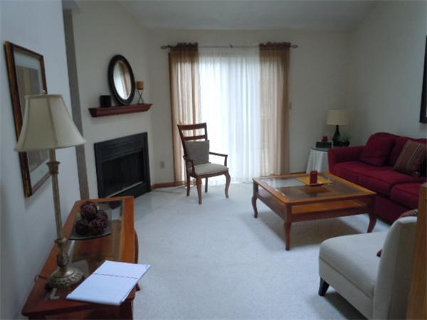 8 David Drive, Unit 8 Natick, MA 01760 - Photo 4 of 9 a living room with furniture and a fireplace