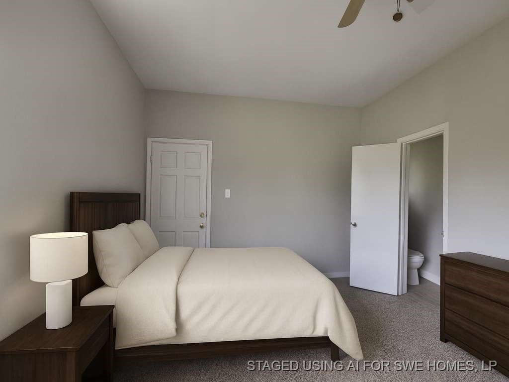 1824 Magnolia Street Liberty, TX 77575 - Photo 11 of 17 a bedroom with a bed and a lamp