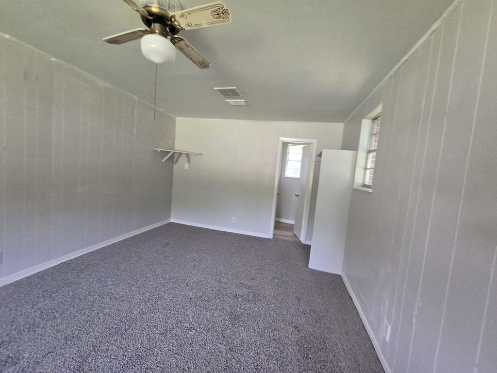 1824 Magnolia Street Liberty, TX 77575 - Photo 13 of 17 wooden floor in an empty room