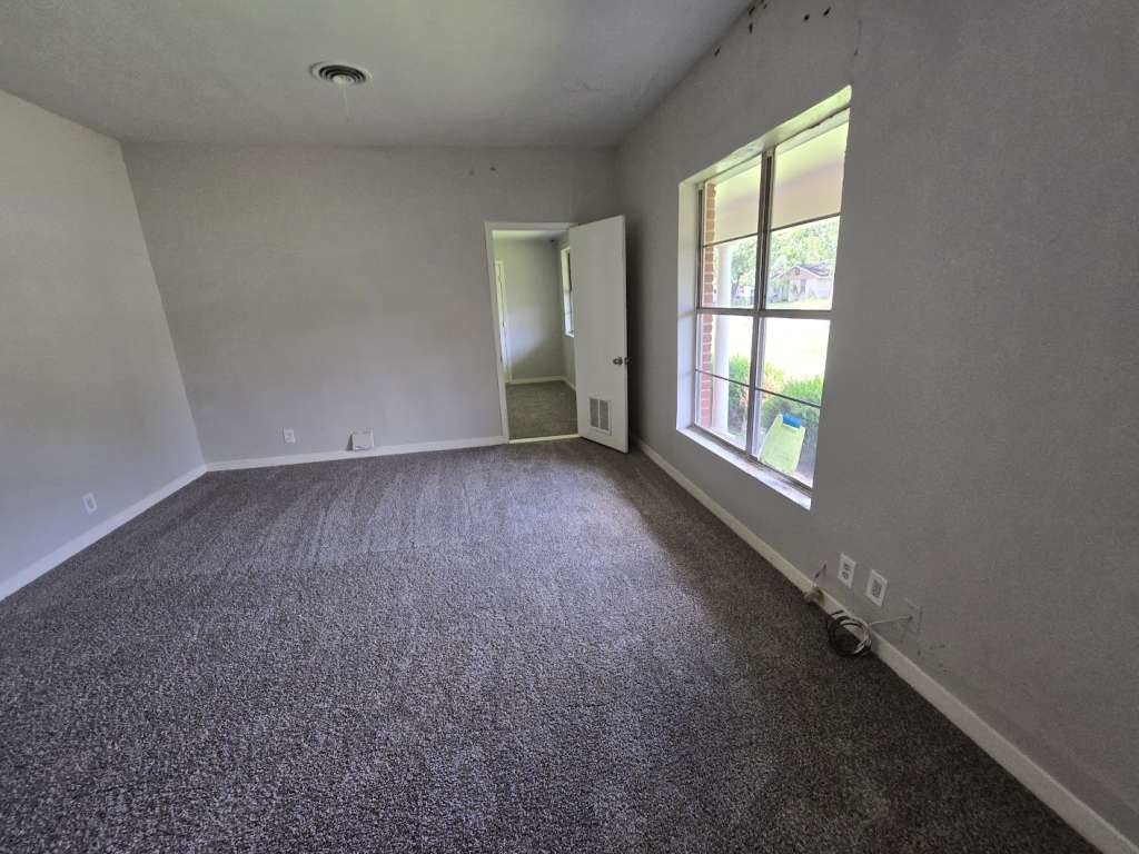 1824 Magnolia Street Liberty, TX 77575 - Photo 8 of 17 an empty room with a window